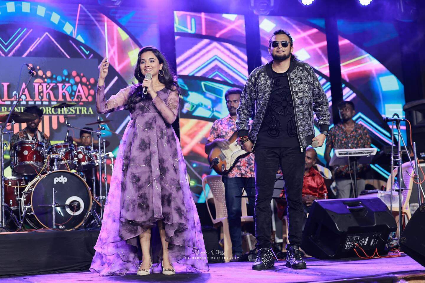 Alaikka Music Band live performance with lead singers on stage